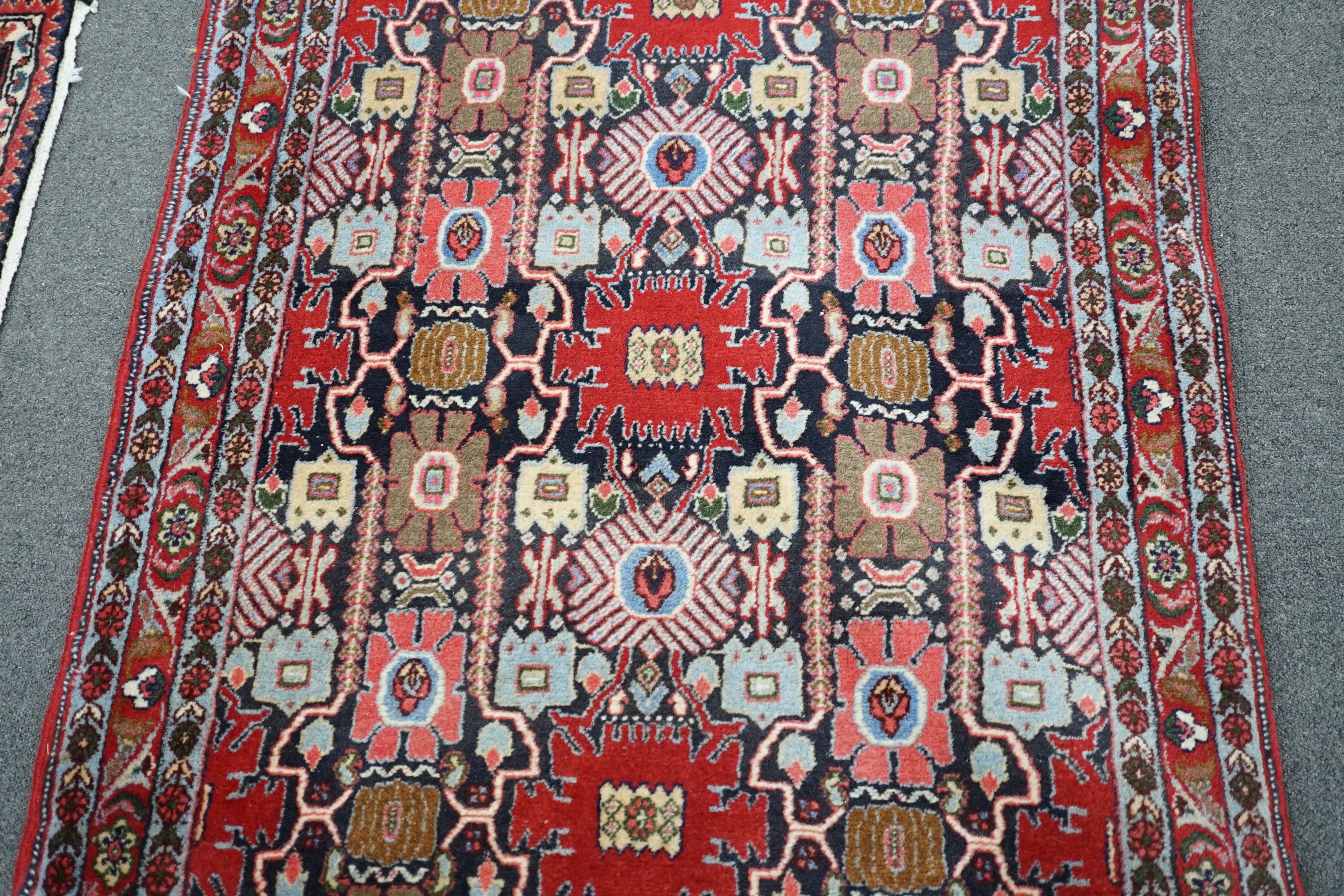 A North West Persian blue ground geometric runner 390cm x 88cm